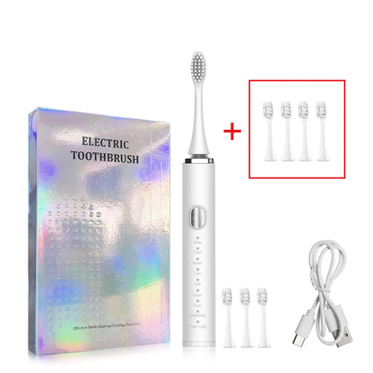 Electric toothbrush set with packaging, brush head, and charging cable on a white background