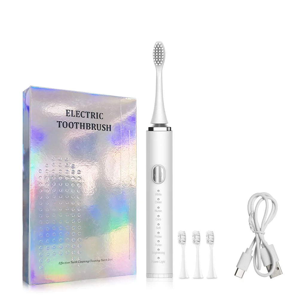 Electric toothbrush set with packaging, brush head, and charging cable on a white background