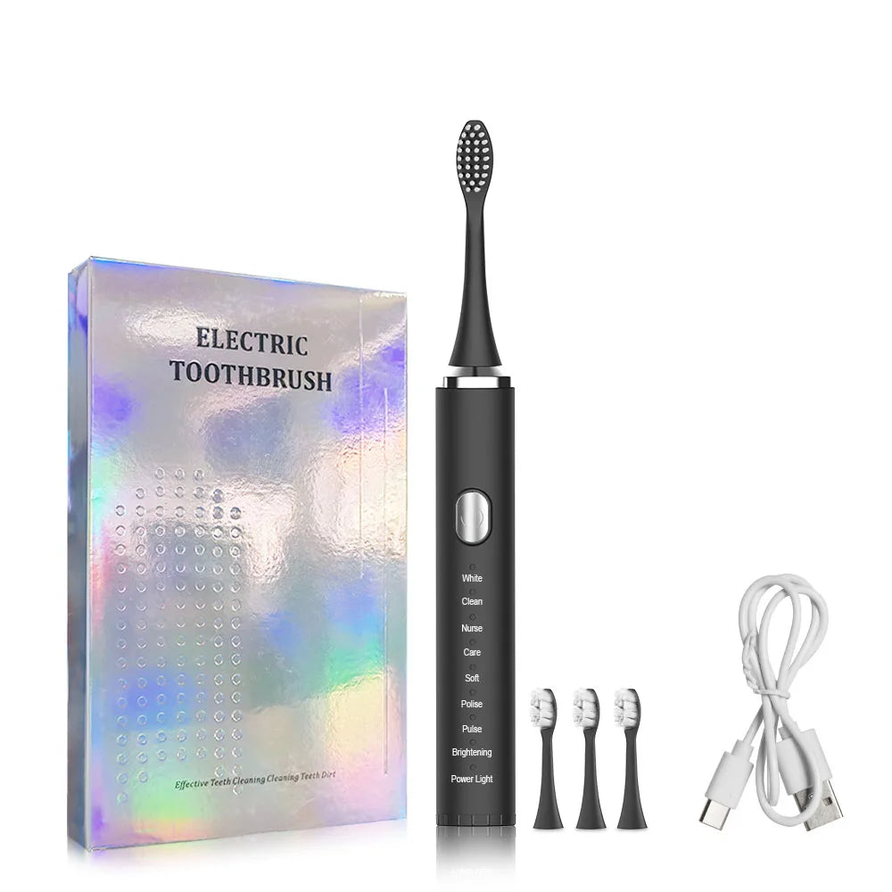 Black electric toothbrush with packaging, brush heads, and charging cable on a white background